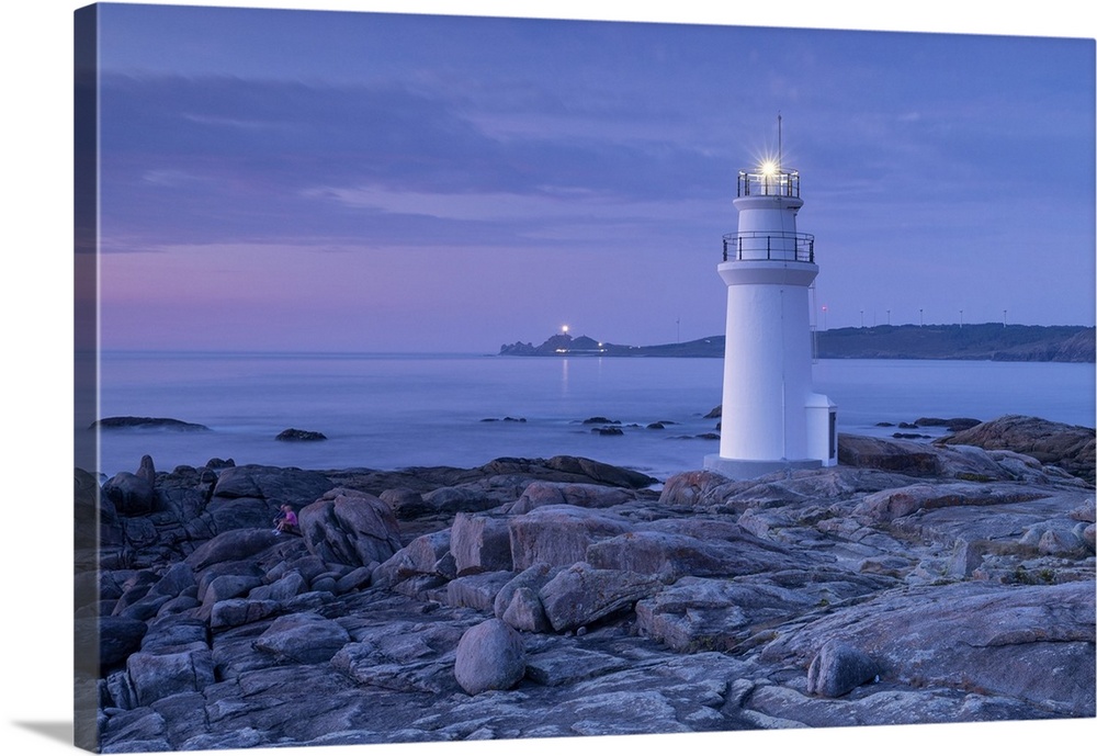Lighthouse of Muxia at dusk during a summer day, municipality of Muxia, Galicia, Spain.