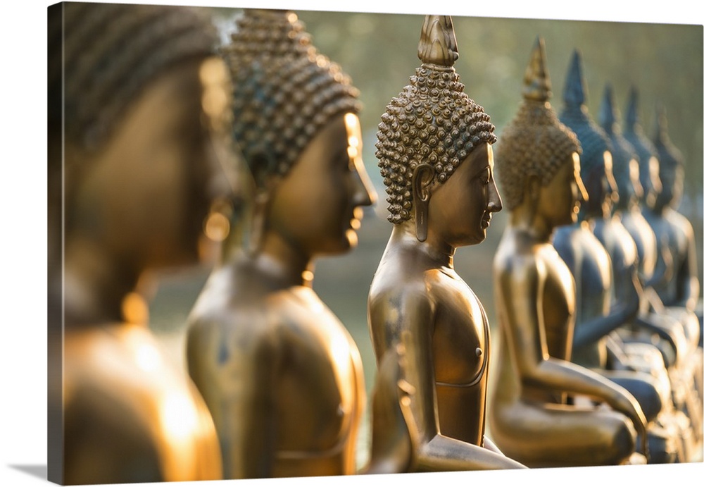 Line of Buddha statues, Seema Malaka temple on Beira Lake. Colombo, Sri Lanka.