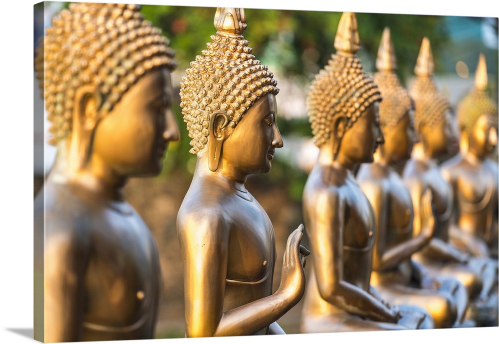 Line of Buddha statues, Seema Malaka temple on Beira Lake. Colombo, Sri Lanka.