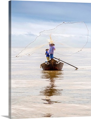 Local Fisherman Casting The Fishing Net From The Boat, Near Hoi An, Vietnam