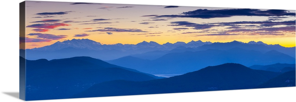 View towards Swiss Alps from Monte San Salvatore illuminated at sunset, Lugano, Lake Lugano, Ticino, Switzerland.