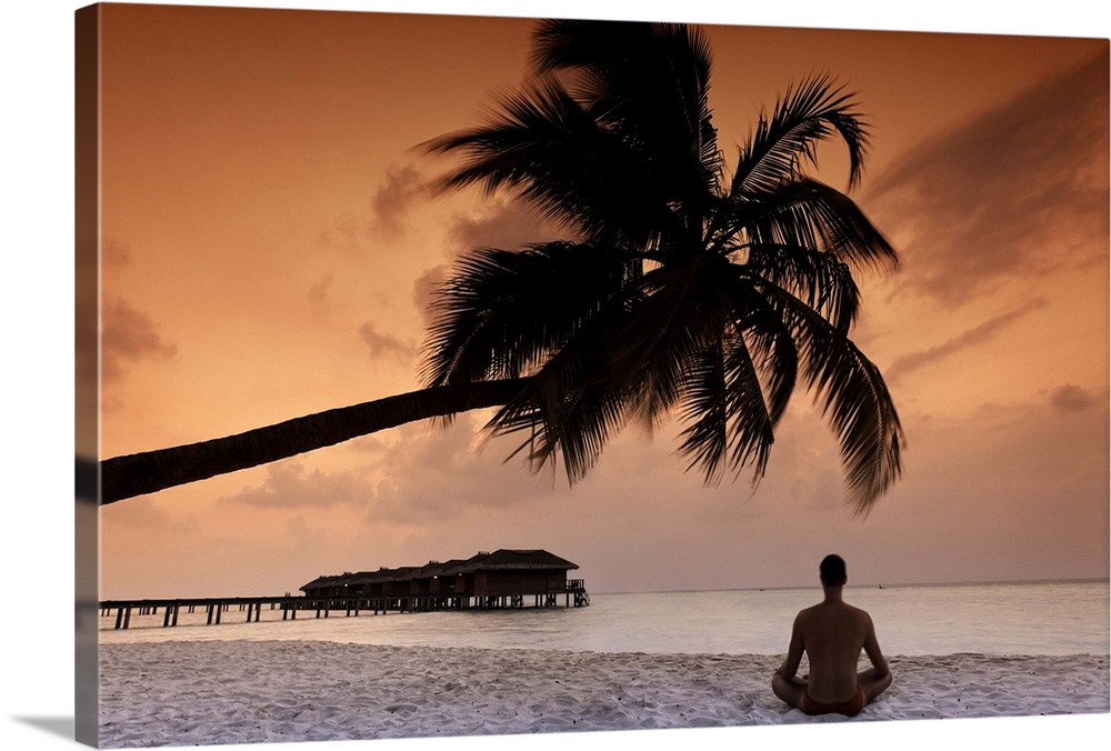 Maldives, Meemu Atoll, Medhufushi Island, Man meditating on the beach (MR)