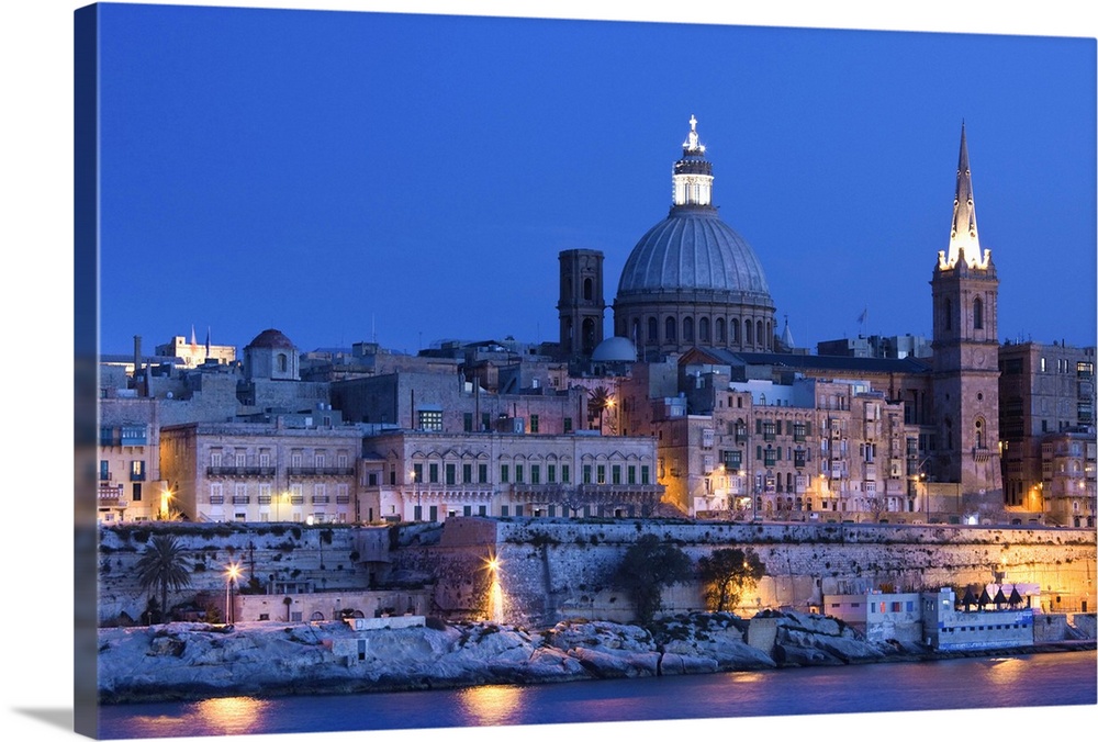 Malta, Valletta, skyline with St. Paul's Anglican Cathedral and Carmelite Church from Sliema, dusk