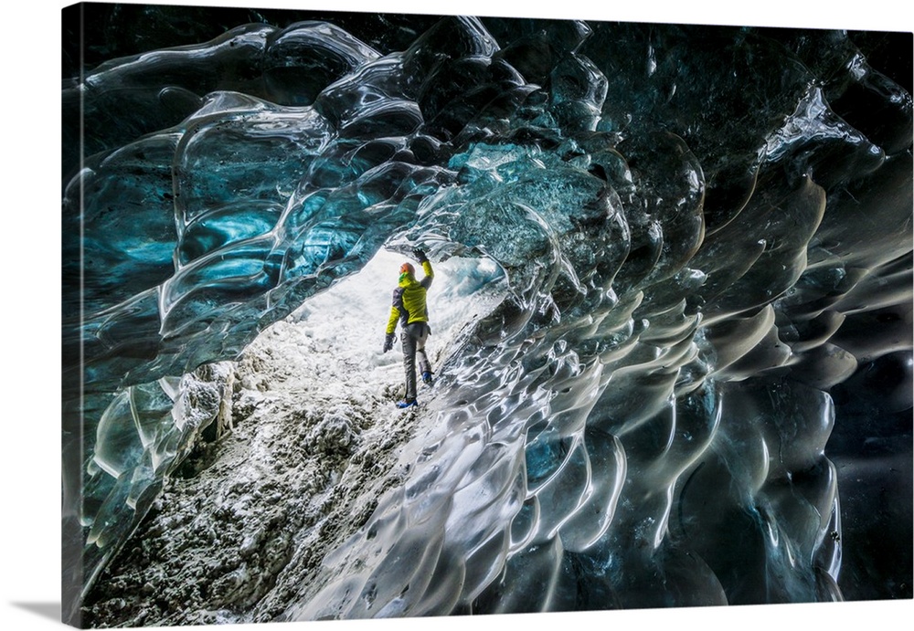 Man inside an ice cave under the Vatnajokull glacier, Vatnajokull national park, East Iceland, Iceland.