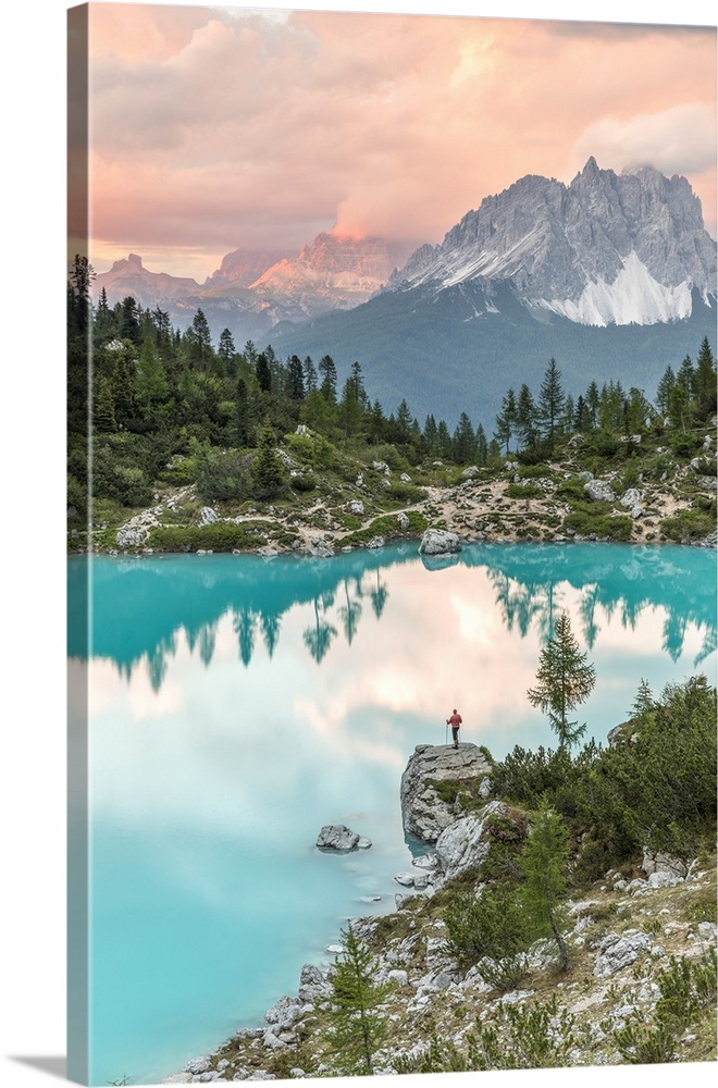 Man standing at sunset at Lake Sorapiss, Sorapiss Lake, Dolomites, Veneto, Italy (MR).