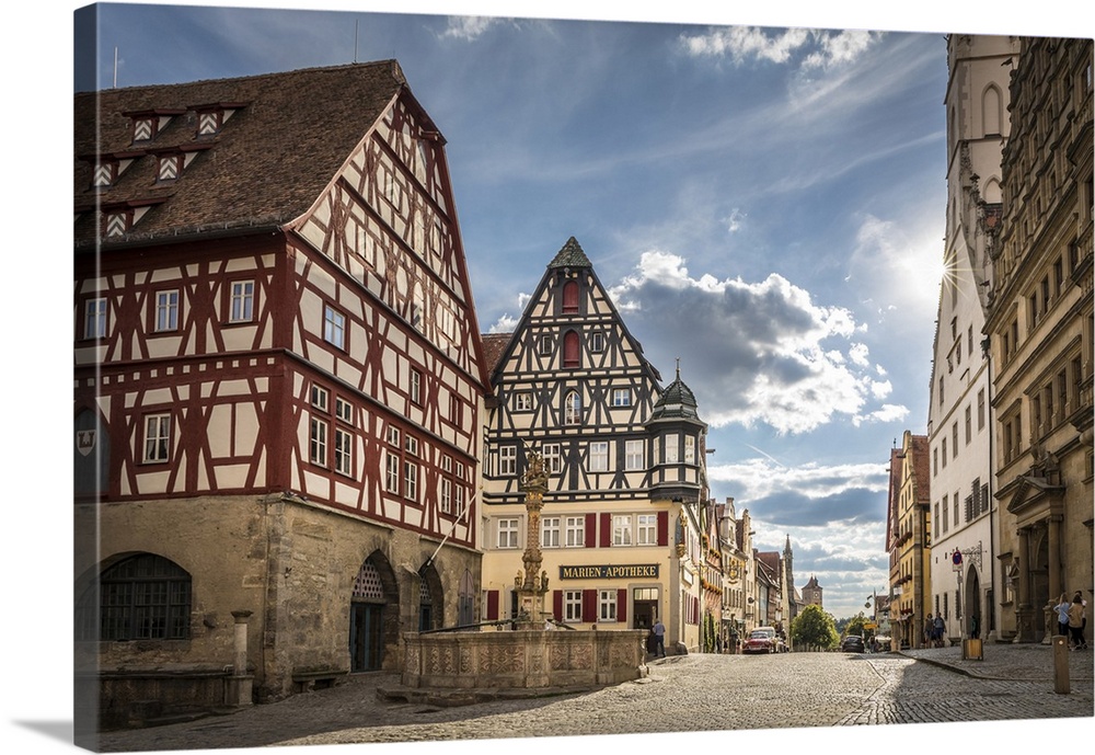 Market Square fountain and historic houses in Herrngasse in the old town of Rothenburg ob der Tauber, Middle Franconia, Ba...