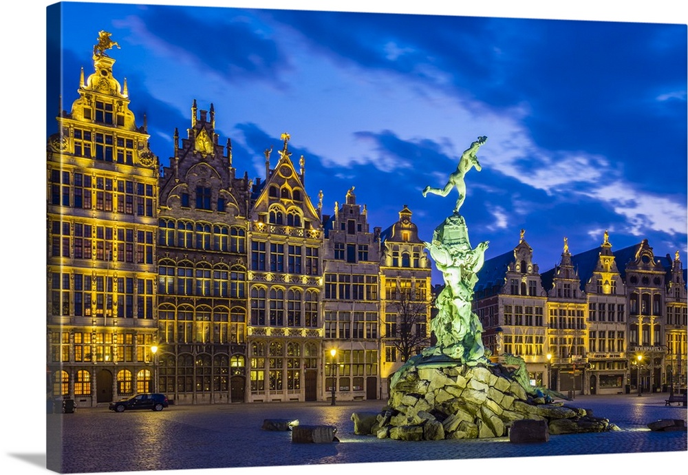Belgium, Flanders, Antwerp (Antwerpen). Medieval guild houses and statue of Silvius Brabo on Grote Markt square at dawn.
