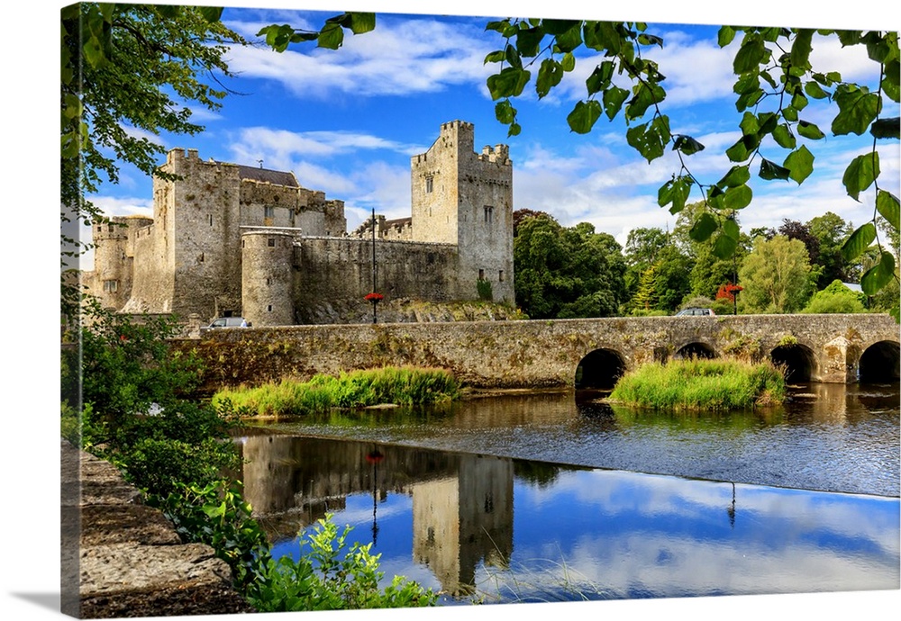 Europe, Ireland, Caher, Tipperary, medieval town of Caher with fortress and bridge reflecting in the river