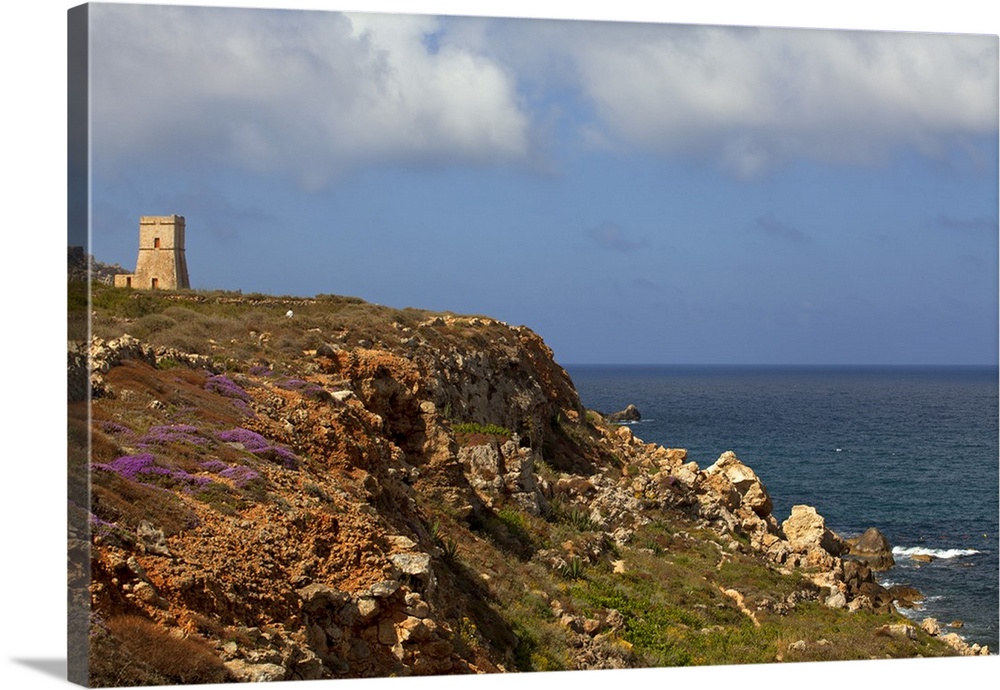 Mediterranean Europe, Malta. Historical tower on top of a hill onlooking the coast which in the past was used to guard aga...