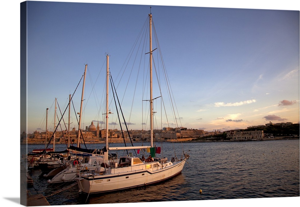 Mediterranean Europe, Malta. Yachts parked in a harbour in Tigne with Valletta in the background.