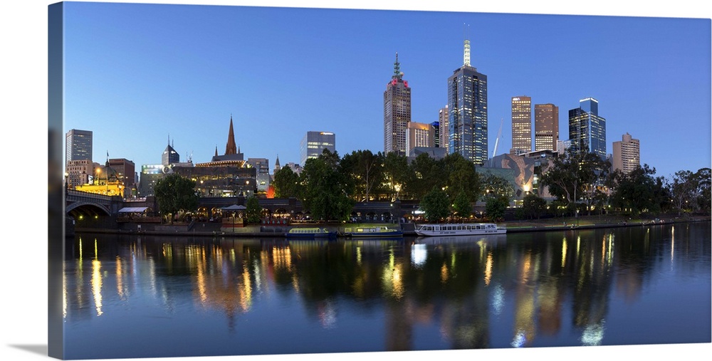Melbourne skyline along Yarra River at dusk, Melbourne, Victoria, Australia.