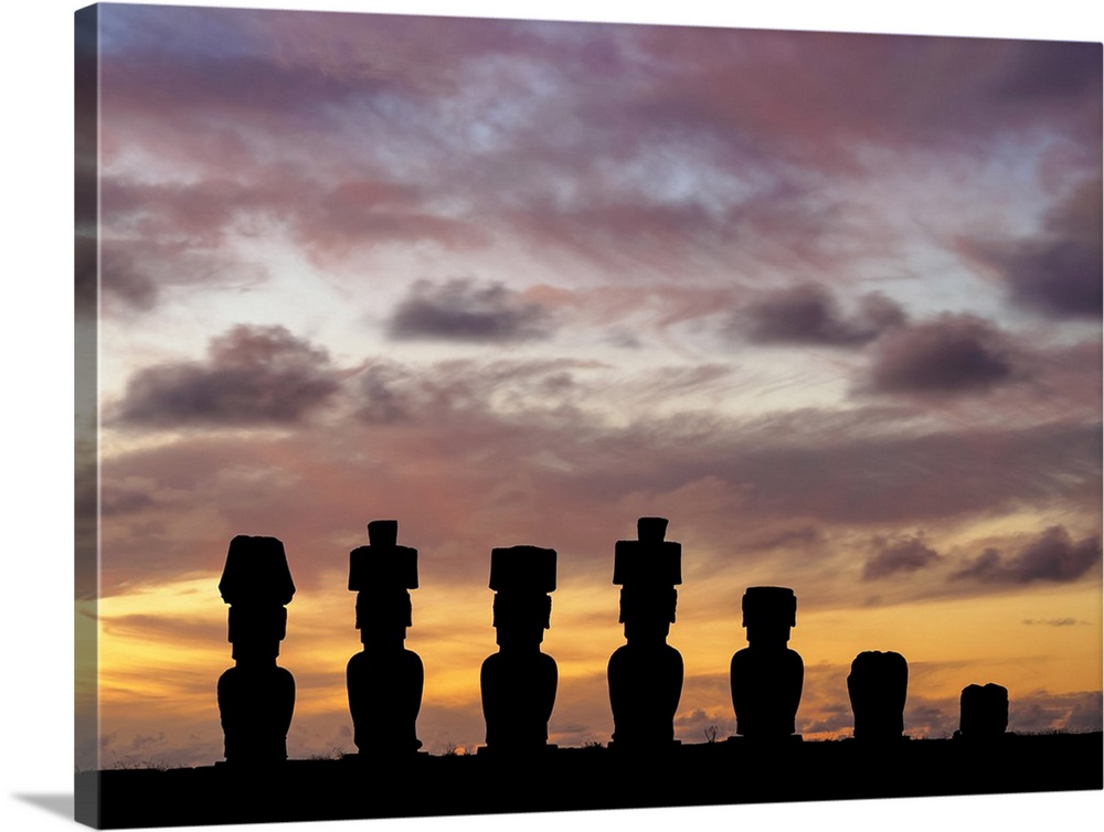 Moais in Ahu Nau Nau by the Anakena Beach at sunset, Rapa Nui National Park, Easter Island, Chile