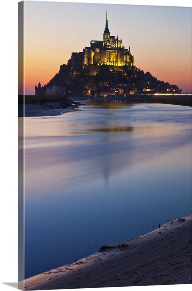 Mont Saint Michel and its connection to the mainland via a tidal causeway with the River Couesnon on the left at low tide ...