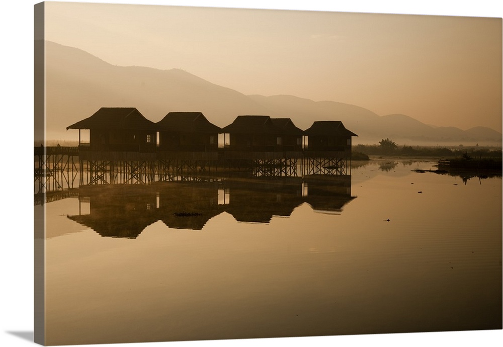 Myanmar, Inle Lake. A misty dawn at Golden Island Cottages, a resort for tourists owned by the Pa-O people, a collection o...