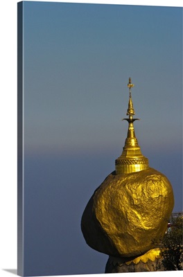 Myanmar, The Golden Rock boulder balanced precariously on the edge of Mount Kyaiktiyo