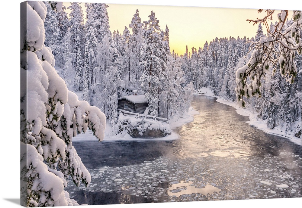 Myllykoski frozen rapids and snowy mill into an arctic forest at sunrise, Juuma, Oulanka National Park, Kuusamo, Lapland, ...