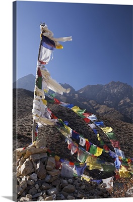 Nepal, Prayer flags fluttering at Dajori La Pass, high up above the village of Samar