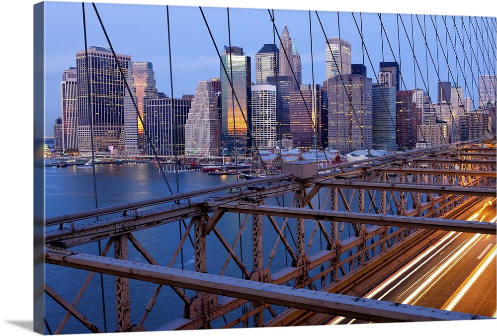 USA, New York City, Manhattan,  Downtown Financial District City Skyline viewed from the Brooklyn Bridge at dawn