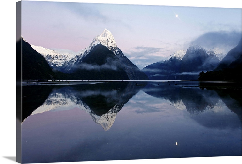 New Zealand, Nuova Zelanda, Fiordland, Milford Sound and moon during a cold and misty sunrise.