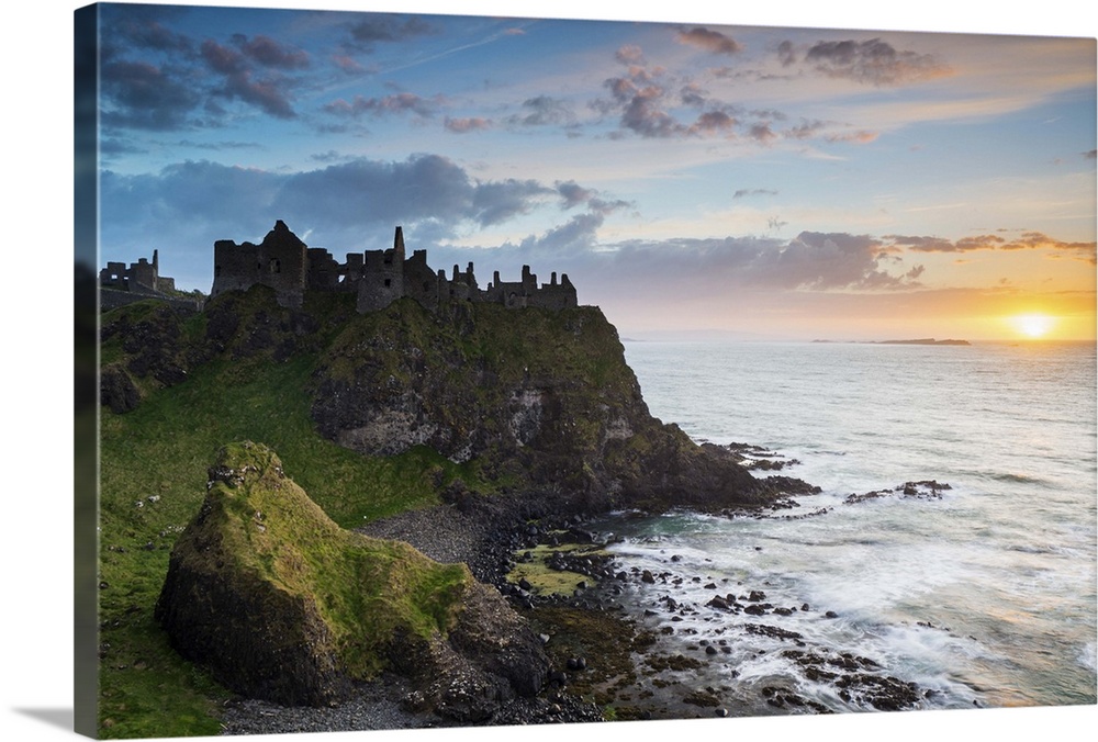 United Kingdom, Northern Ireland, County Antrim, Bushmills. The ruins of the 13th century Dunluce Castle.