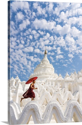 Novice Monk Running And Jumping At Hsinbyume Pagoda, Myanmar