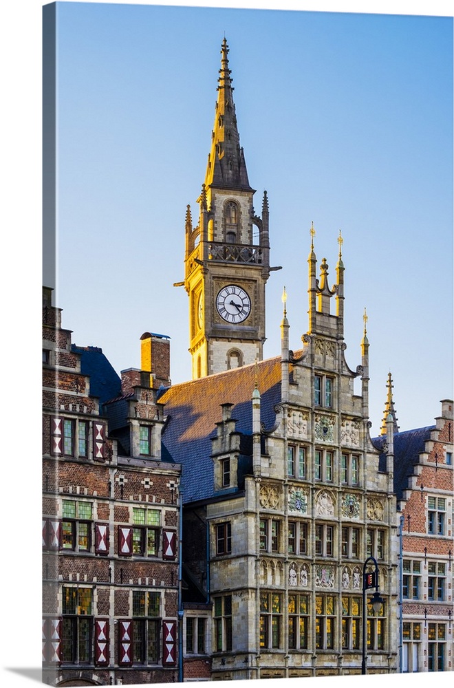 Belgium, Flanders, Ghent (Gent). Old Post Office clock tower and medieval guild houses on Graslei.