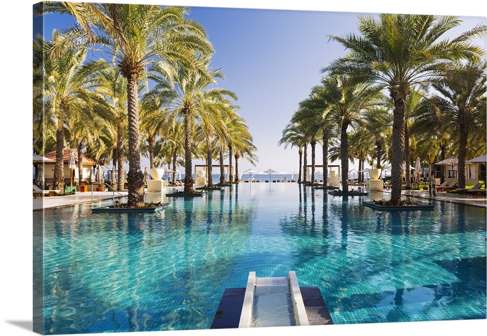 Oman. Muscat Governorate, Muscat. The 50 metre infinity pool at the Ritz Carlton Al Bustan Palace Hotel.