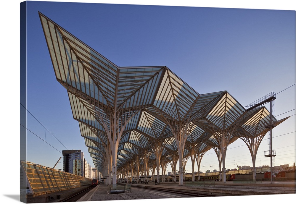 Contemporary modern steel and glass railway platform canopy of the Oriente Railway station, designed by the the architect ...