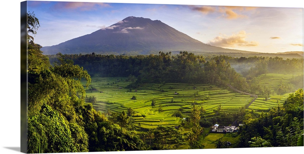 Sidemen valley, Rendang, Karangasem Regency, Bali, Indonesia. Paddy fields with Gunung Agung (Mt Agung) volcano at sunrise.