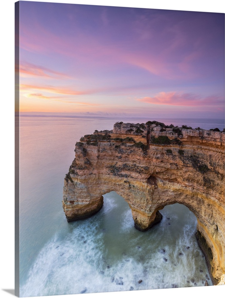Panorama of cliffs framed by turquoise sea at dawn Praia da Marinha Caramujeira Lagoa Municipality Algarve Portugal Europe