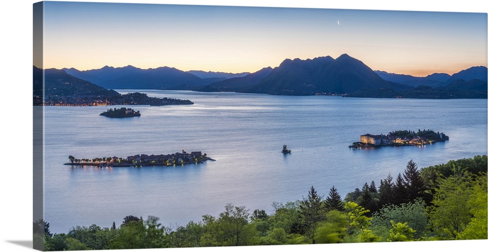 Borromean Islands, Stresa, Lake Maggiore, Verbano-Cusio-Ossola, Piedmont, Italy. Panoramic view over the isles at dawn wit...