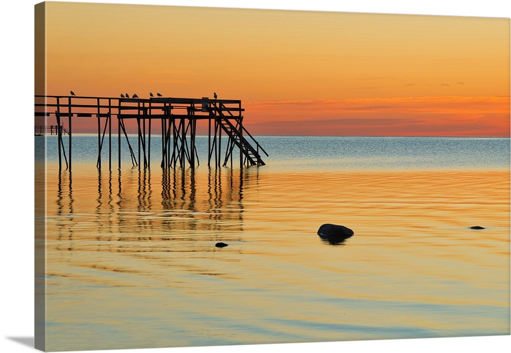 Pier (dock) on Lake Winnipeg at sunrise Matlock, Manitoba, Canada