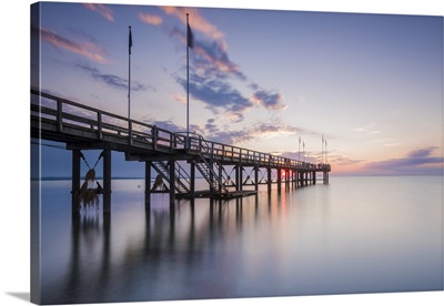 Pier over the Baltic sea at sunset