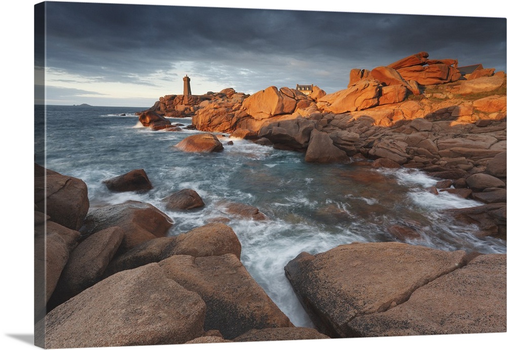 Pink Granite coast, Brittany, France. The Ploumanach lighthouse (Men Ruz) an sunset.