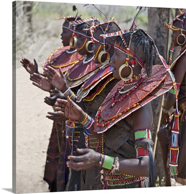 Pokot women wearing traditional beaded ornaments and brass earrings