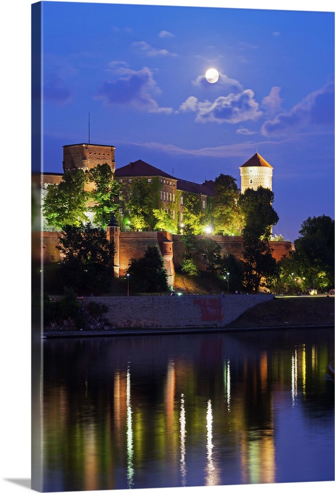 Europe, Poland, Malopolska, Krakow, full moon over Wawel Hill Castle and Cathedral, Vistula River, UNESCO site.