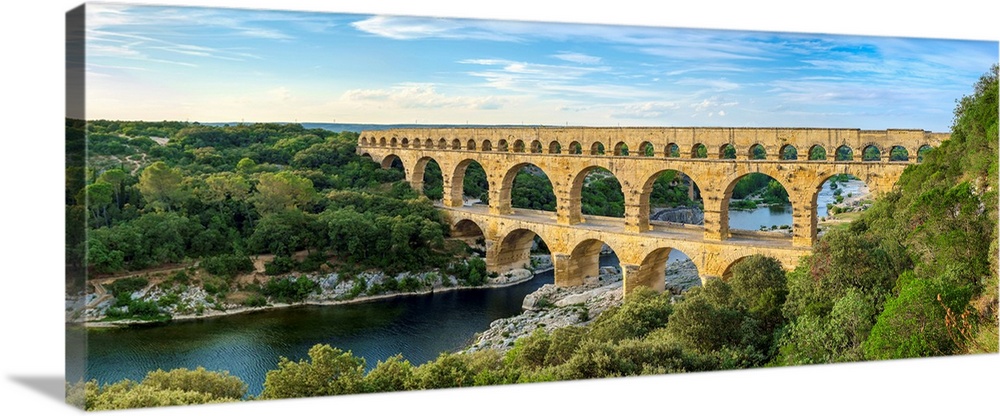 Pont du Gard Roman aqueduct over Gard River in late afternoon, Gard Department, Languedoc-Roussillon, France.