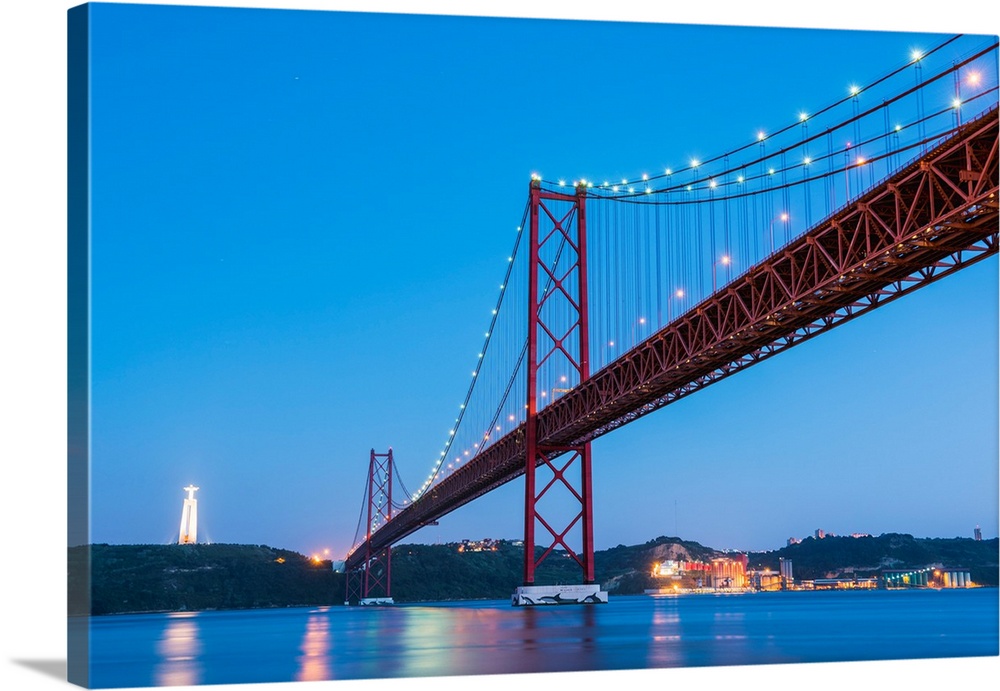 Portugal, Lisbon. The 25 de Abril Bridge across the Tagus river and Cristo Rei (Christ the King).