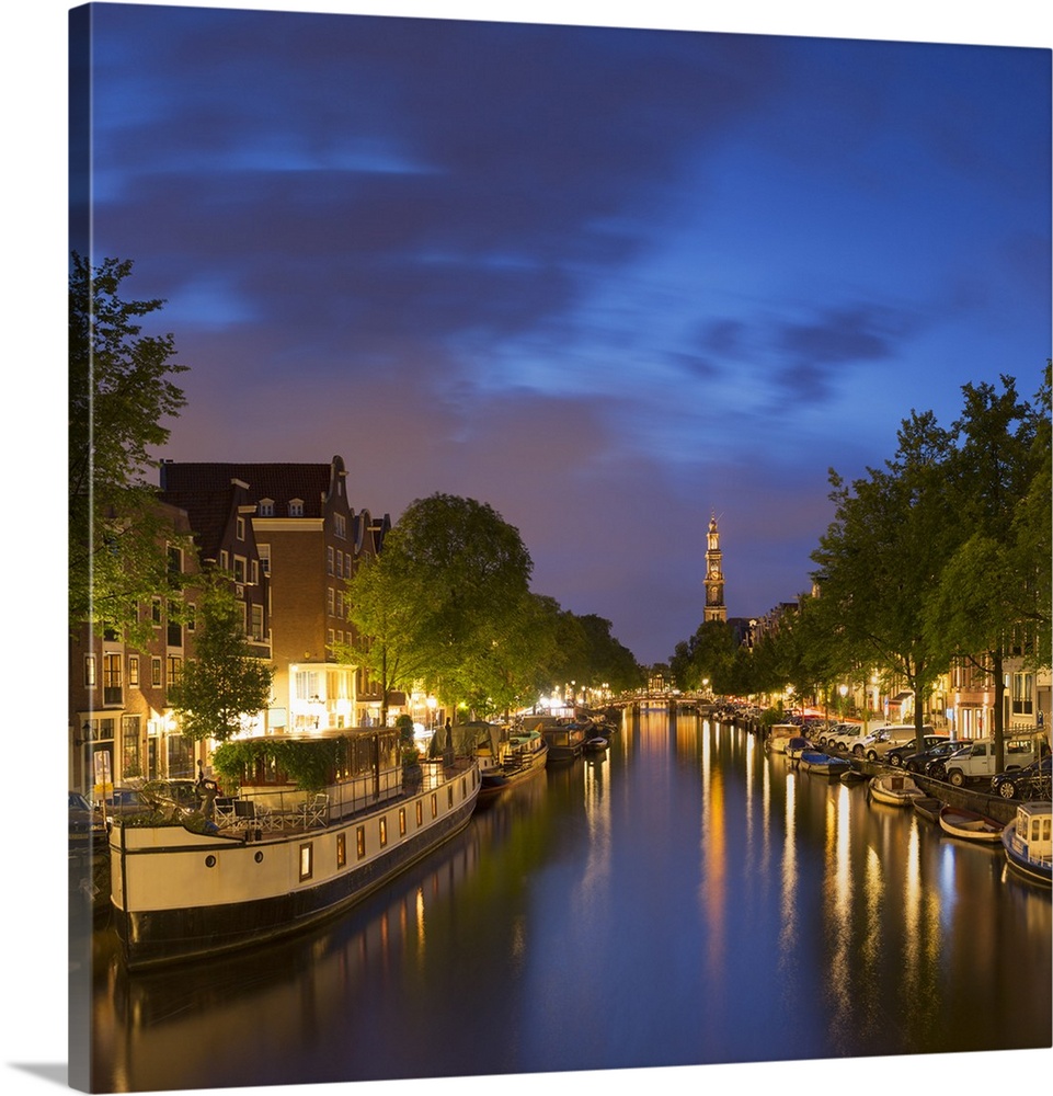 Prinsengracht canal and Westerkerk at dusk, Amsterdam, Netherlands.