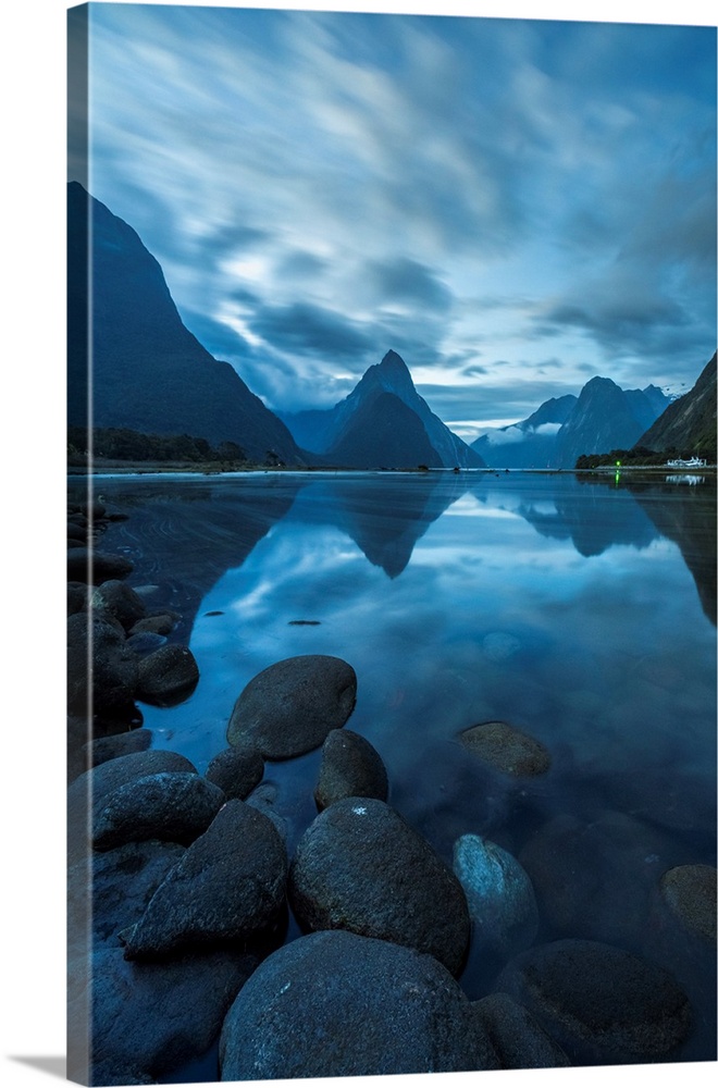 Reflection of Milford Sound at dusk in summer. Fiordland NP, Southland district, Southland region, South Island, New Zealand.