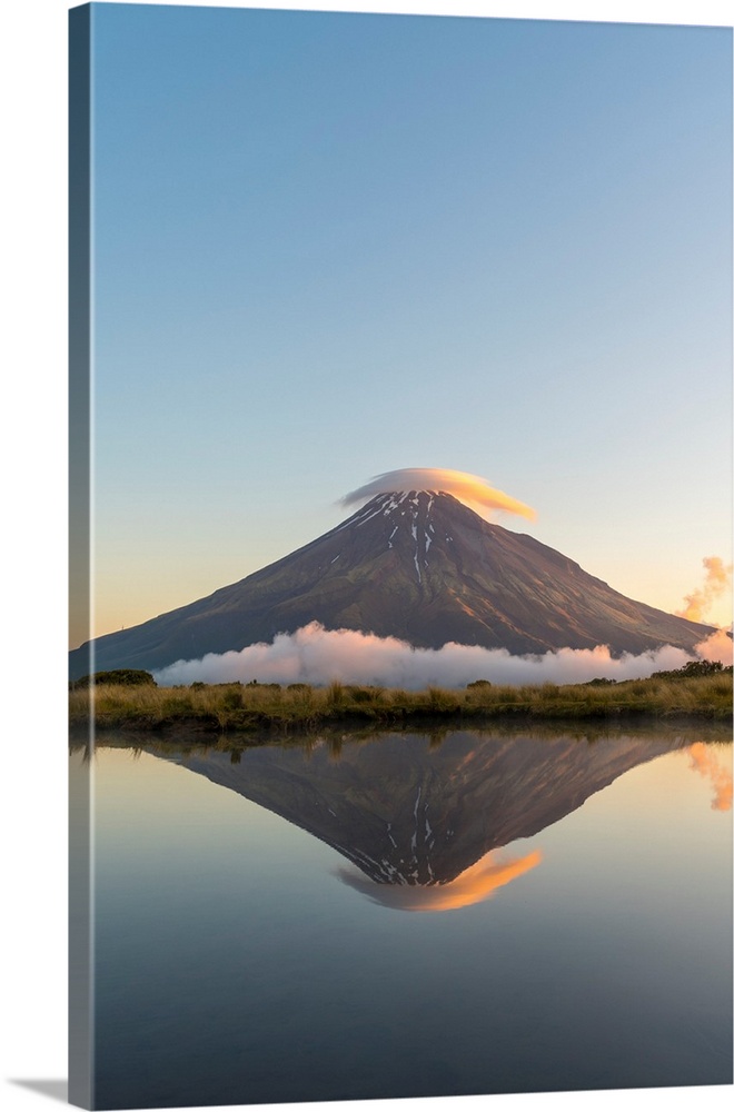 Reflection of Mount Taranaki at sunset. Egmont National Park, New Plymouth district, Taranaki region, North Island, New Ze...