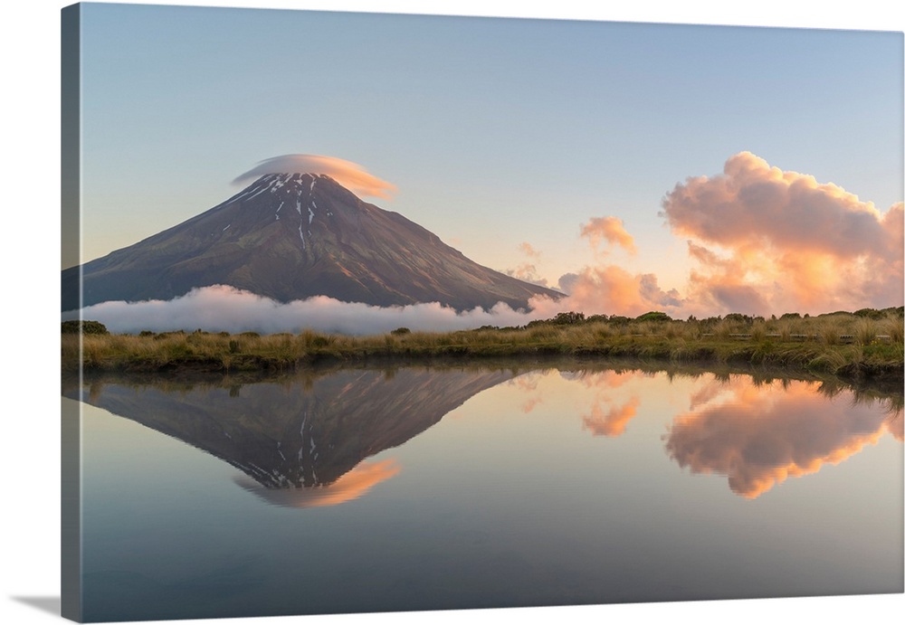 Reflection of Mount Taranaki at sunset. Egmont National Park, New Plymouth district, Taranaki region, North Island, New Ze...