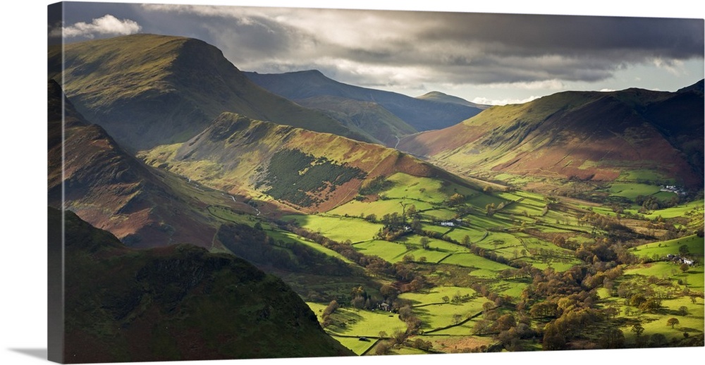 Rich autumn sunlight illuminates Newlands Valley in the Lake District, Cumbria, England.