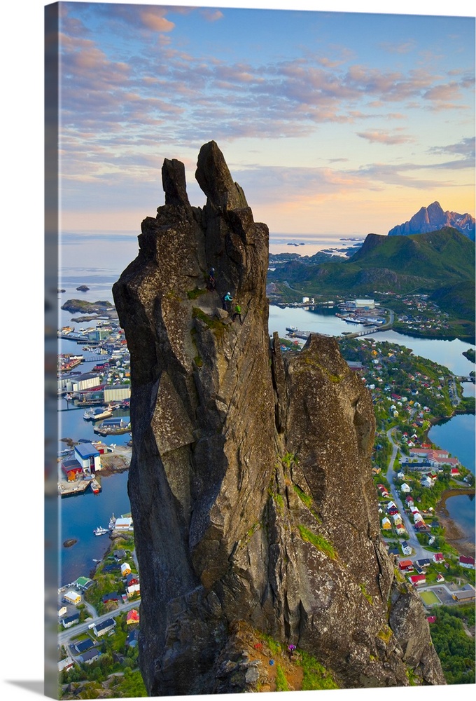 Rock Climbers scale the famous Svolvaergeita, Svolvaer, Lofoten, Nordland, Norway