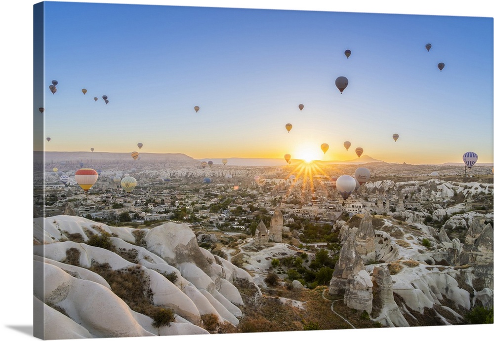 Rock formations, hot air balloons at sunrise, Goreme, Goreme Historical National Park, Nevsehir District, Nevsehir Provinc...