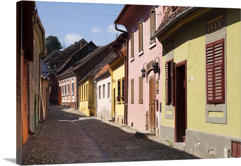 Romania, Transylvania, Sighisoara. Colourful houses within the medieval fortress town of Sighisoara.