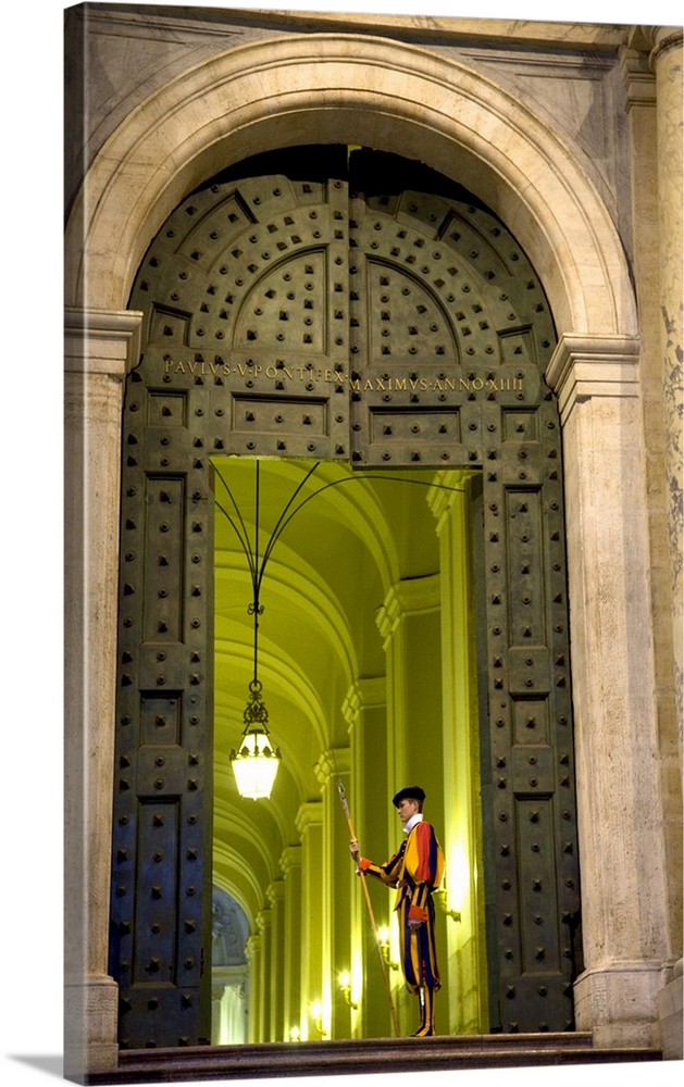 Rome, Italy, A Swiss guard at the entrance gates to the Vatican.