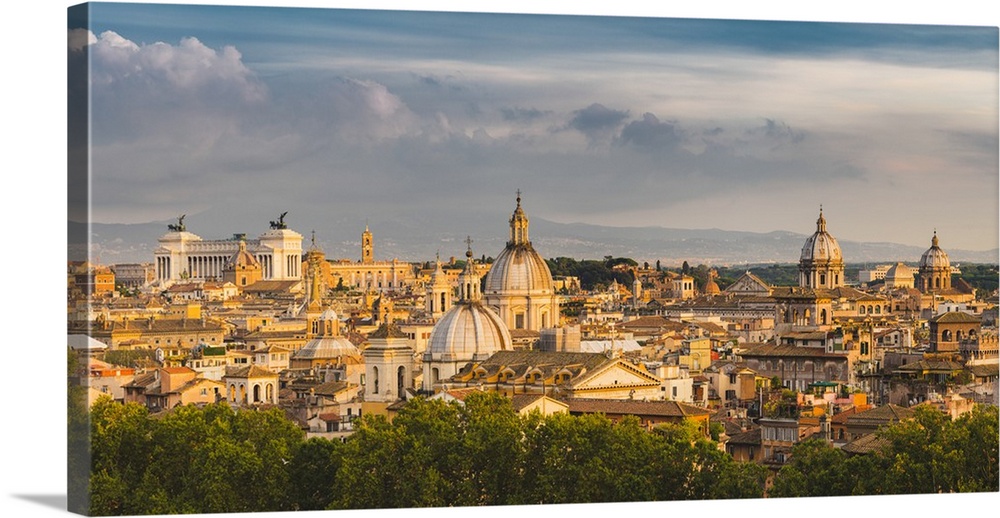 Rome, Lazio, Italy. High angle view over the old town's cupolas and the Altar of the Fatherland (Altare della Patria).