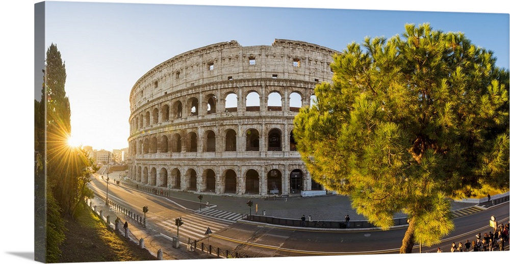 Rome, Lazio, Italy. High angle panoramic view over the Colosseum square at sunrise.