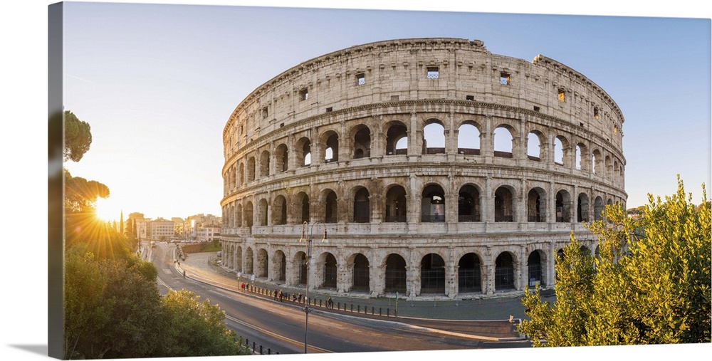 Rome, Lazio, Italy. High angle panoramic view over the Colosseum square at sunrise.